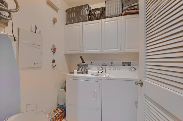 laundry area featuring cabinets, washer and dryer, and hookup for a washing machine