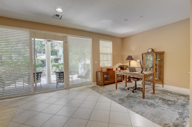 office area featuring light tile flooring