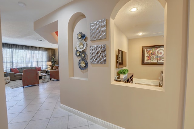 hallway with light tile floors