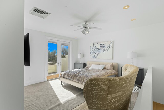 bedroom with ceiling fan, access to exterior, and light carpet