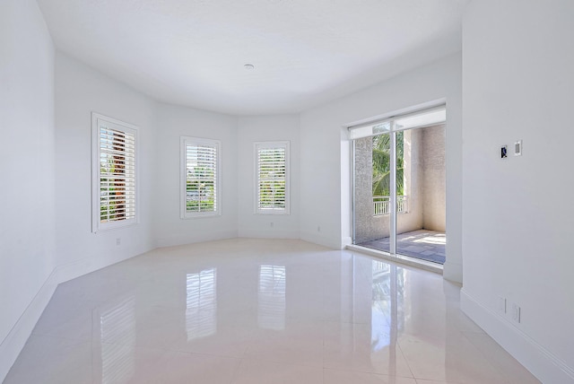 spare room with light tile floors