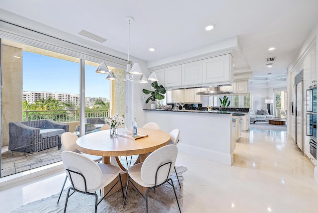 dining space featuring light tile flooring