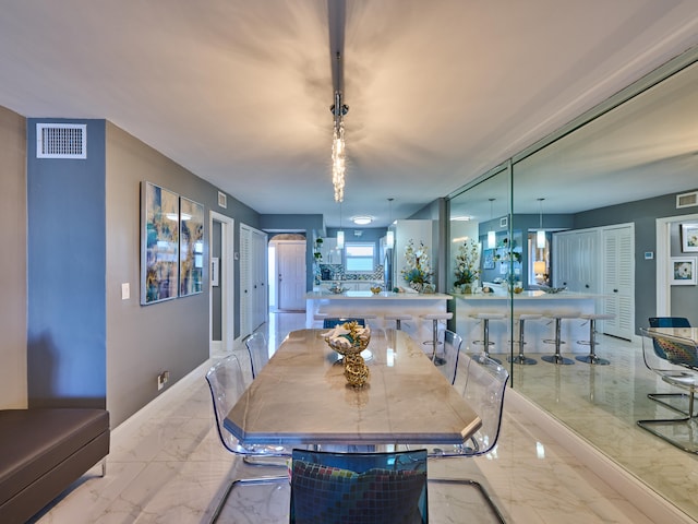 dining room with light tile floors