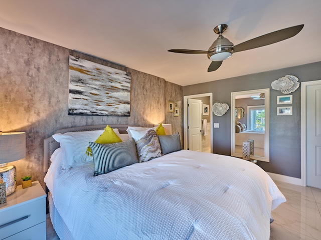 bedroom with ceiling fan and light tile floors