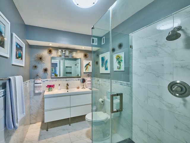 bathroom featuring vanity with extensive cabinet space, an enclosed shower, and tile floors