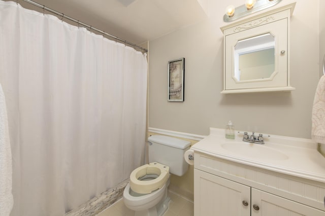 bathroom with tile patterned floors, toilet, a shower with shower curtain, and vanity