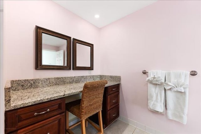 interior space with vanity and tile floors