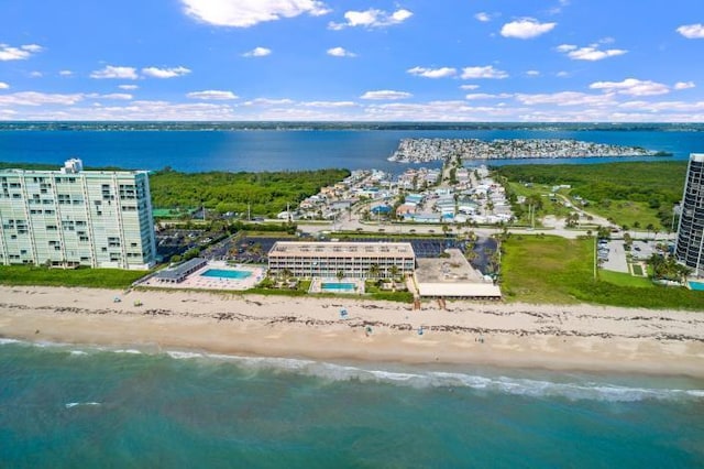 bird's eye view featuring a beach view and a water view