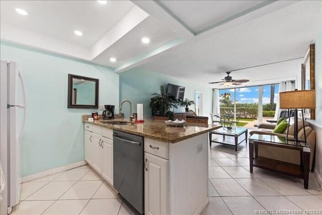 kitchen featuring white fridge, ceiling fan, white cabinets, dark stone counters, and dishwasher