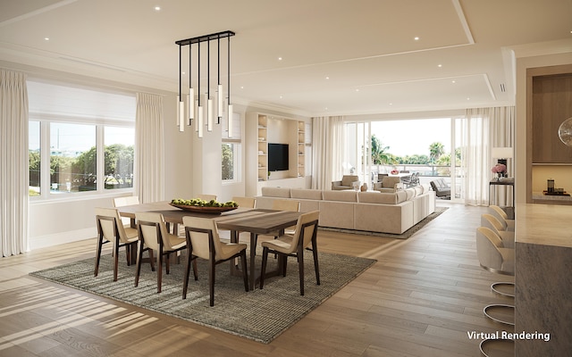 dining room with crown molding and light hardwood / wood-style flooring