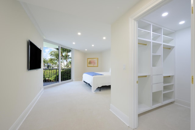 unfurnished bedroom with crown molding, access to exterior, and light colored carpet