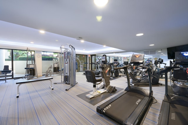 exercise room with light carpet