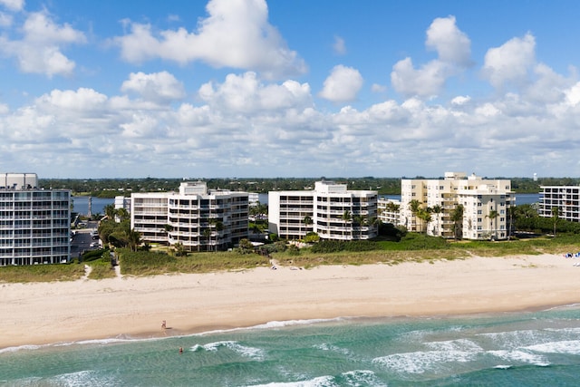 aerial view featuring a water view and a view of the beach