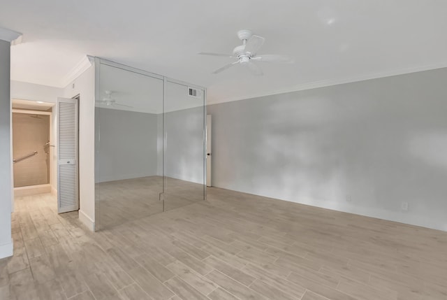 unfurnished bedroom featuring ornamental molding, ceiling fan, and light hardwood / wood-style flooring