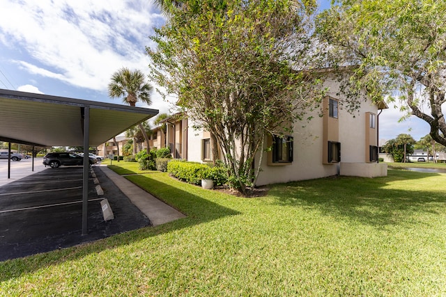 view of yard with a carport