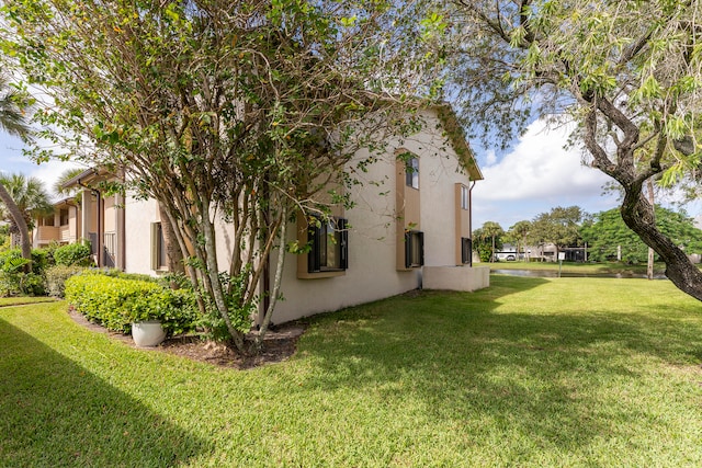 view of property exterior featuring a yard