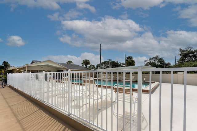 view of swimming pool with a patio area