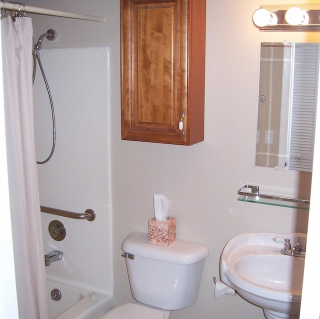 full bathroom with shower / tub combo, sink, and toilet