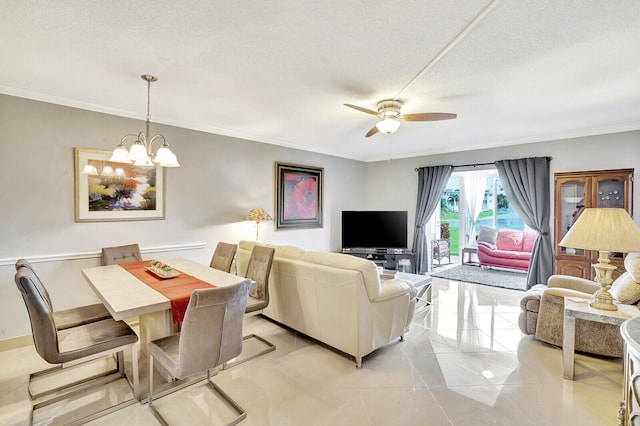 living room with light tile flooring, a textured ceiling, ornamental molding, and ceiling fan with notable chandelier