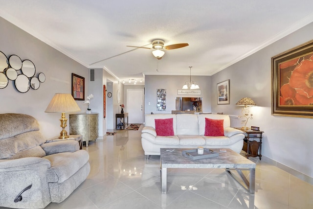 living room featuring light tile floors, a textured ceiling, crown molding, and ceiling fan with notable chandelier