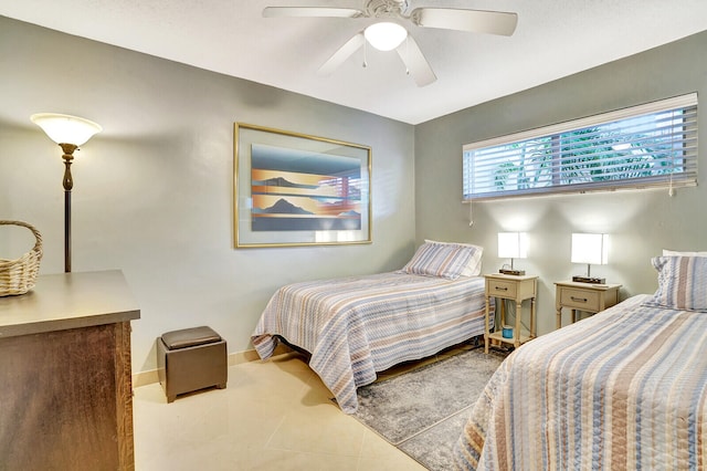 tiled bedroom with ceiling fan