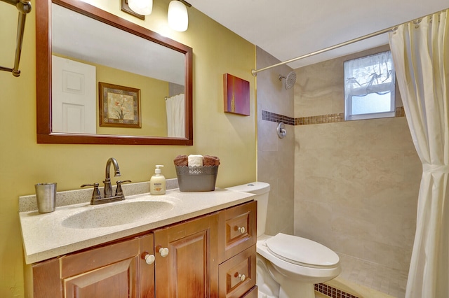 bathroom featuring a shower with curtain, toilet, and vanity