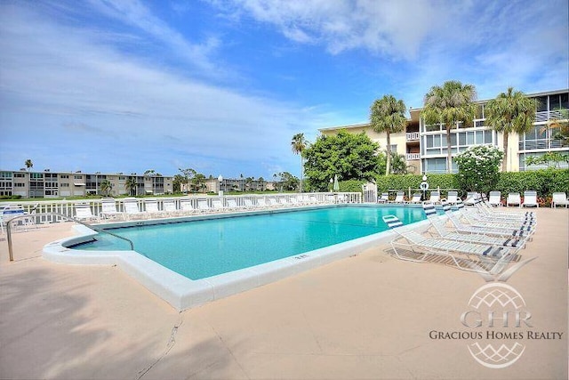 view of swimming pool featuring a patio