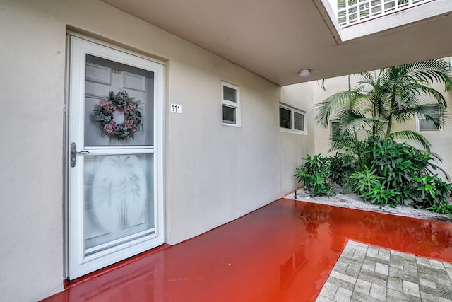 entrance to property featuring a patio