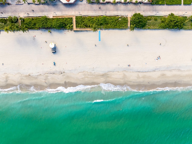 aerial view with a beach view and a water view