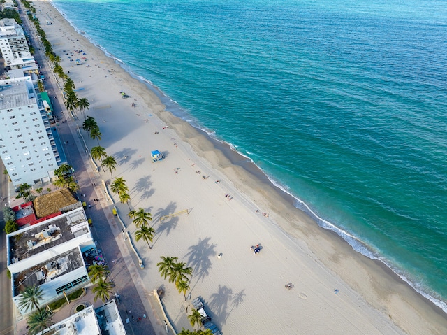 bird's eye view featuring a beach view and a water view