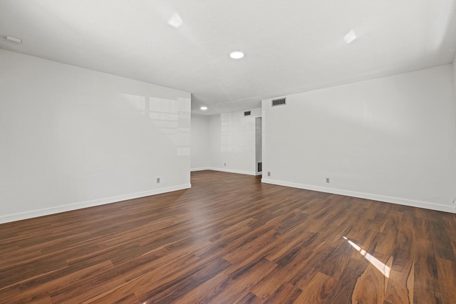 empty room featuring dark hardwood / wood-style flooring