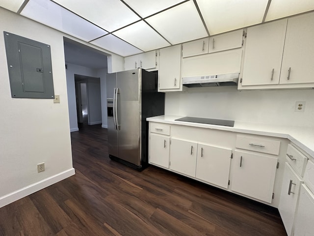 kitchen featuring electric panel, white cabinetry, dark wood-type flooring, stainless steel fridge, and black electric cooktop