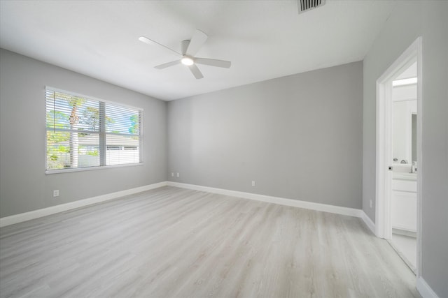 empty room featuring ceiling fan and light wood-type flooring