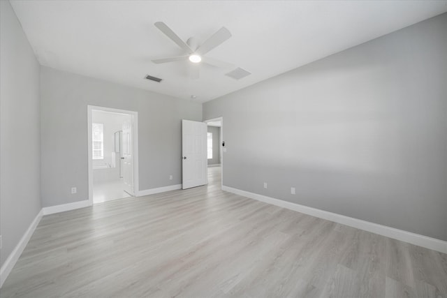 empty room featuring ceiling fan and light wood-type flooring