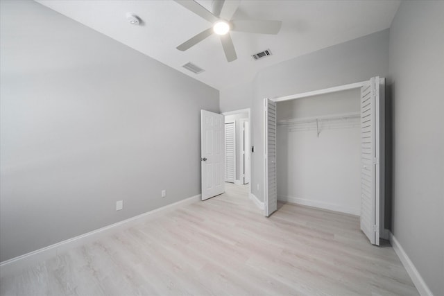 unfurnished bedroom with a closet, light hardwood / wood-style floors, and ceiling fan