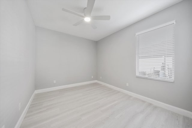 empty room with light hardwood / wood-style floors and ceiling fan