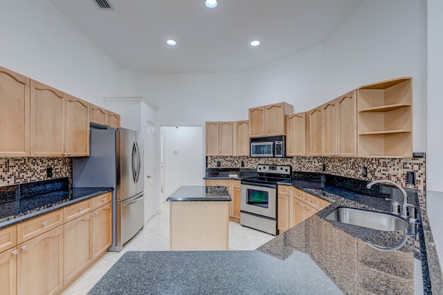 kitchen with backsplash, stainless steel appliances, light tile flooring, and sink