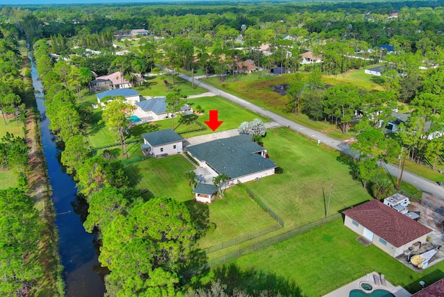 birds eye view of property featuring a water view