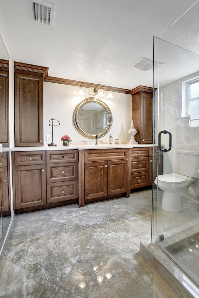 bathroom with an enclosed shower, toilet, vanity, and tile flooring