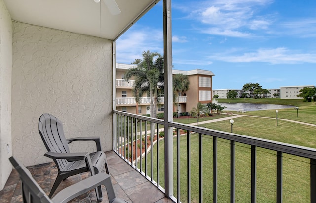 balcony featuring a water view