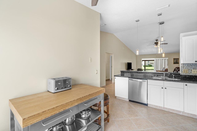 kitchen featuring white cabinetry, vaulted ceiling, ceiling fan, and dishwasher