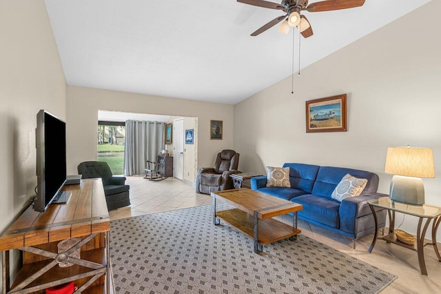 living room with vaulted ceiling, light tile flooring, and ceiling fan