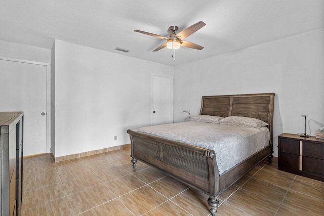 bedroom with tile flooring and ceiling fan