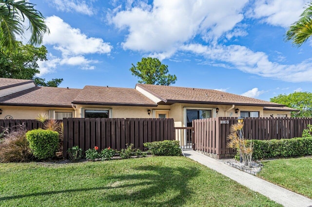 view of side of property featuring a yard