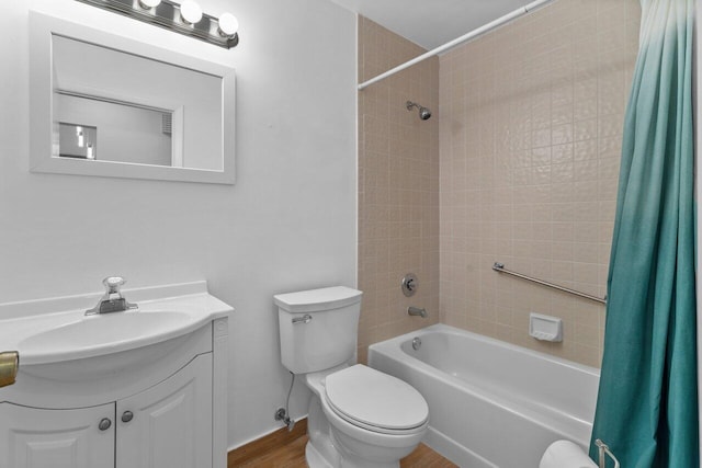 full bathroom with shower / tub combo with curtain, toilet, vanity, and hardwood / wood-style floors