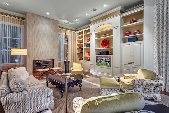 living area featuring ornamental molding and wood-type flooring