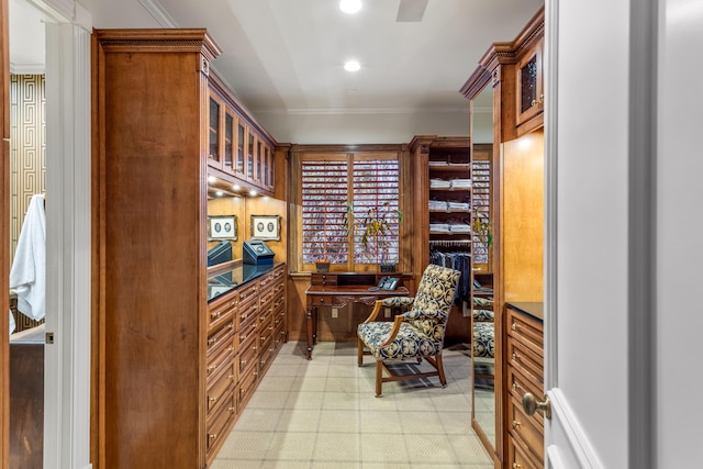 office featuring light tile flooring and ornamental molding