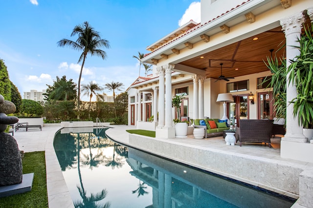 view of swimming pool with a patio area, an outdoor living space, and ceiling fan