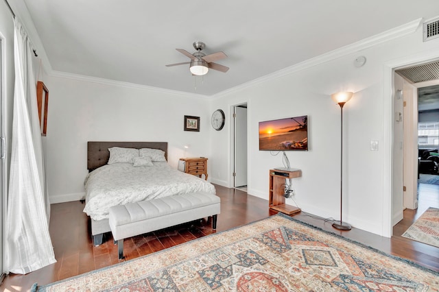 bedroom featuring crown molding, ceiling fan, and dark wood-type flooring