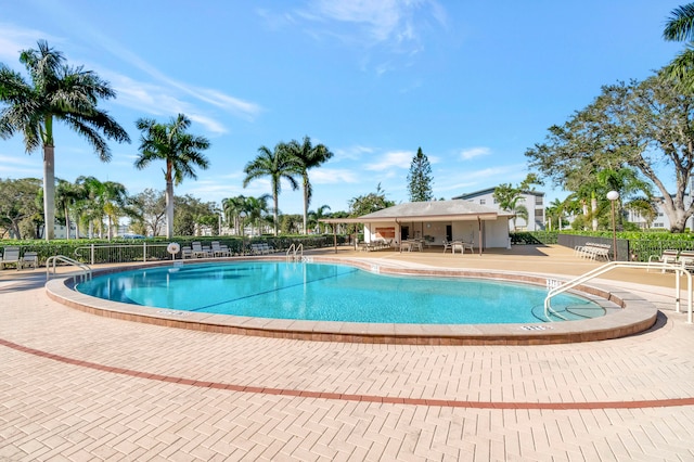 view of swimming pool featuring a patio area